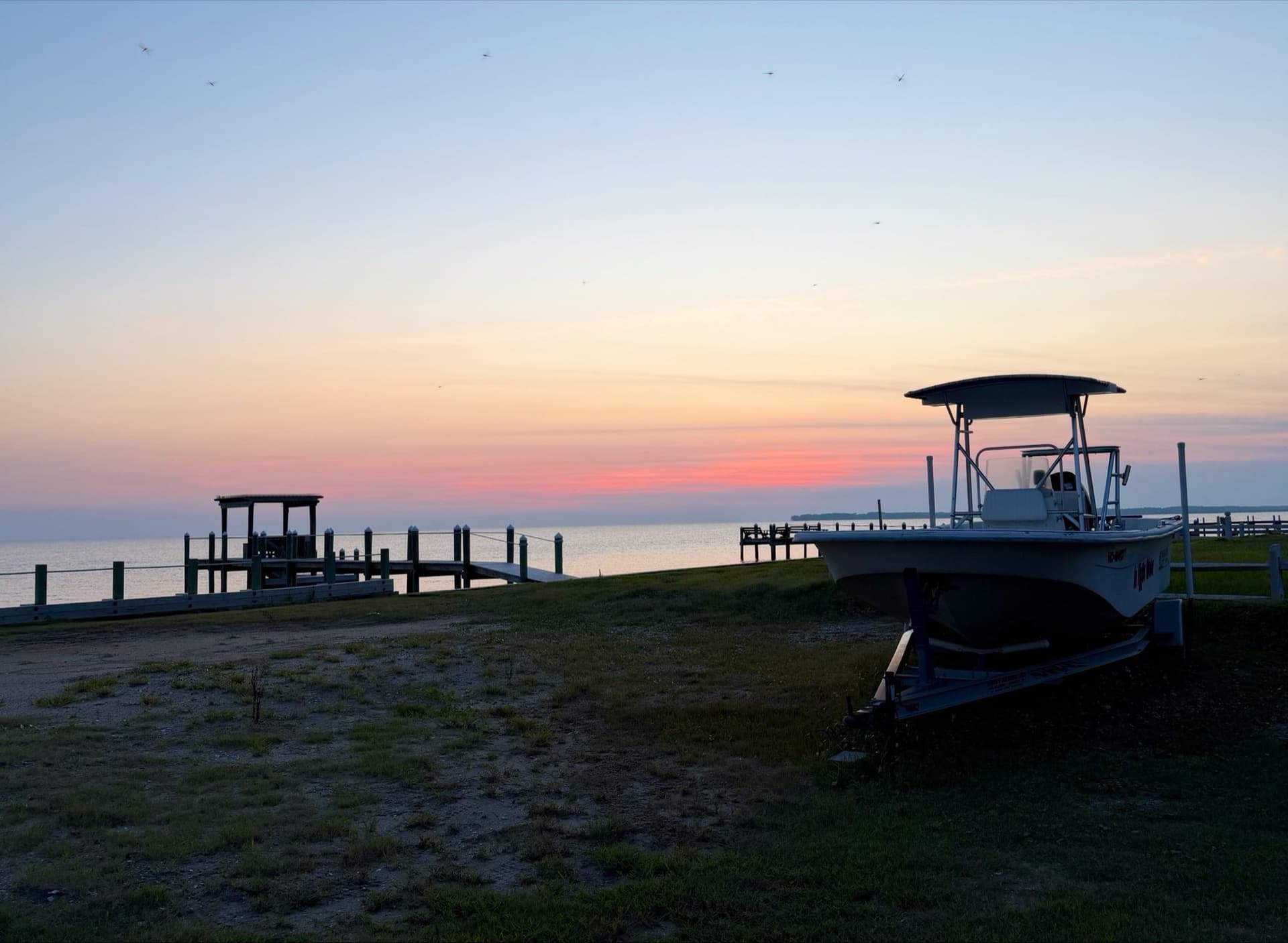 JagOBX soundside golden hour, Outer Banks Golden hour over the Outer Banks sound, dock and boat, photographed by Jag (JagOBX)